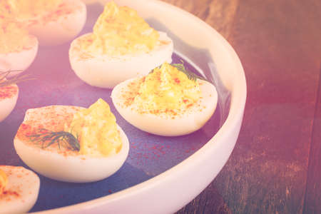 Deviled eggs garnished with fresh dill.の写真素材