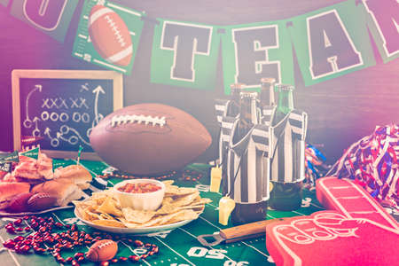 Game day football party table with beer, chips and salsa.の写真素材