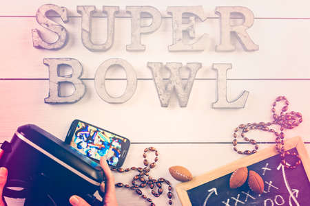 Game day football party table. Watching game on VR goggles.の写真素材