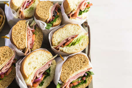 Fresh sub sandwich on white and wheat hoagies.の写真素材