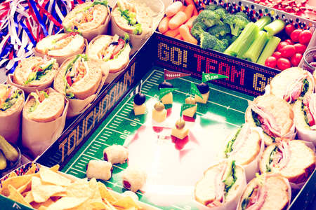 Football Snack Stadium filled with sub sandwiches, veggies and chips.の写真素材