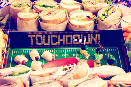 Football Snack Stadium filled with sub sandwiches, veggies and chips.