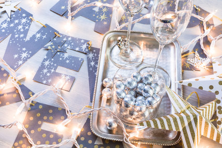 New Year party silver decorations on the table.