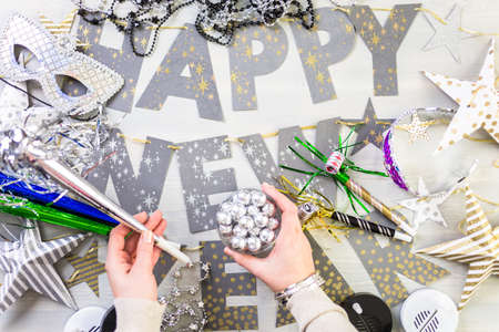 New Year party silver decorations on the table.の写真素材