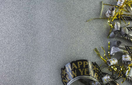 New Year Eve party decorations on silver background.の写真素材