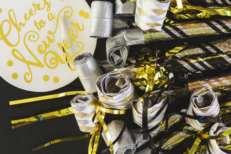 New Year Eve party blowouts on black board.の写真素材