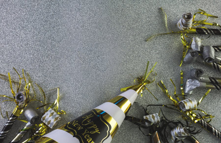 New Year Eve party decorations on silver background.の写真素材