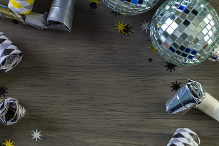 New Year Eve party decorations on gray board.