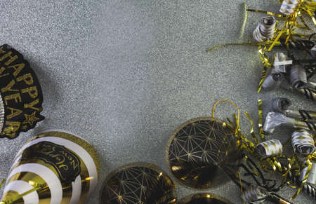 New Year Eve party decorations on silver background.の写真素材