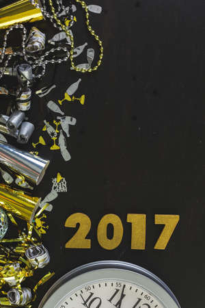New Year Eve party decorations with year on a black background.の写真素材