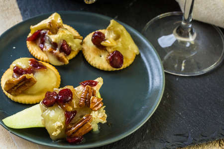 Caramel nut and cranberry brie appetizer for Christmas party.の写真素材