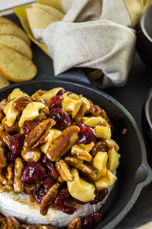 Caramel nut and cranberry brie appetizer for Christmas party.の写真素材