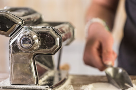 Preparing home made pasta with pasta maker.の写真素材
