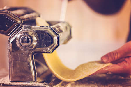 Preparing home made pasta with pasta maker.の写真素材