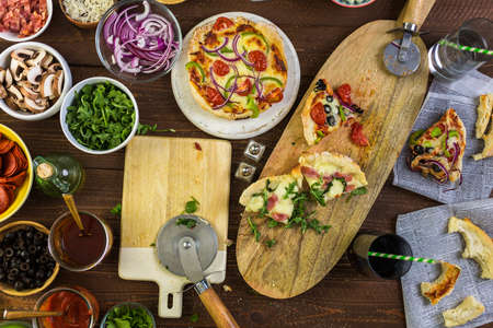 Eating individual pizzas from pizza bar.の写真素材