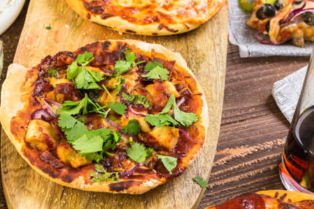 Eating individual pizzas from pizza bar.の写真素材