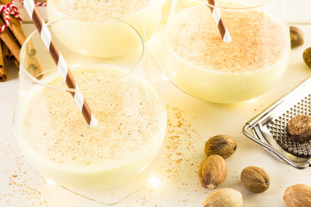 Traditional holiday egg nog garnished with freshly ground nutmeg.