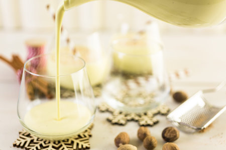 Traditional holiday egg nog garnished with freshly ground nutmeg.