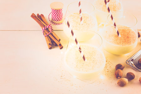 Traditional holiday egg nog garnished with freshly ground nutmeg.の写真素材