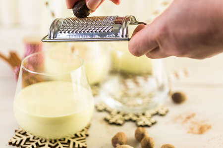 Traditional holiday egg nog garnished with freshly ground nutmeg.の写真素材