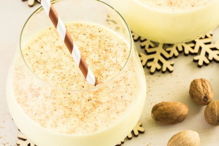 Traditional holiday egg nog garnished with freshly ground nutmeg.