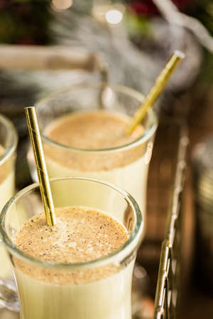 Traditional holiday drink egg nog garnished with nutmeg.の写真素材