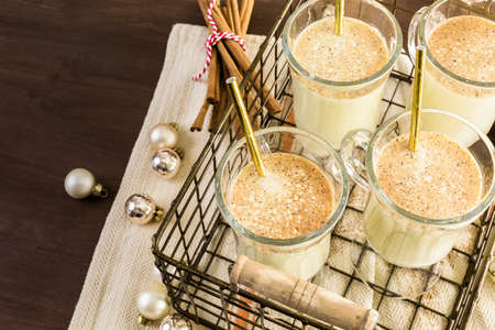 Traditional holiday drink egg nog garnished with nutmeg.の写真素材