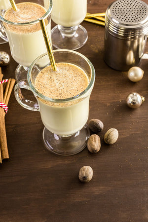 Traditional holiday drink egg nog garnished with nutmeg.