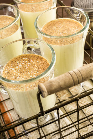 Traditional holiday drink egg nog garnished with nutmeg.の写真素材