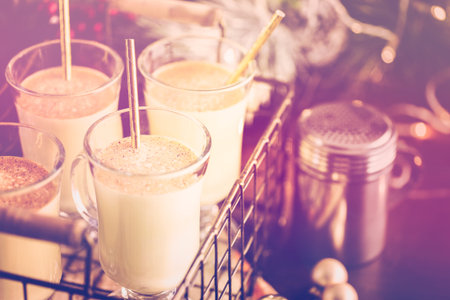 Traditional holiday drink egg nog garnished with nutmeg.