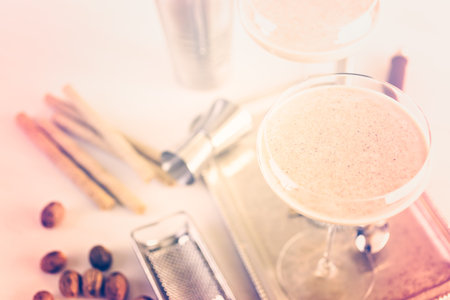 Holiday eggnog cocktail with dark rum and milk garnished with nutmeg.の写真素材