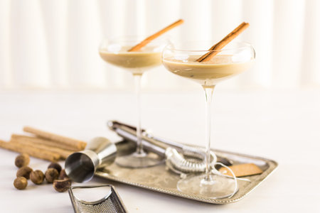 Holiday eggnog cocktail with dark rum and milk garnished with nutmeg.の写真素材