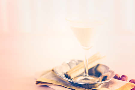 Holiday eggnog cocktail with dark rum and milk garnished with nutmeg.の写真素材