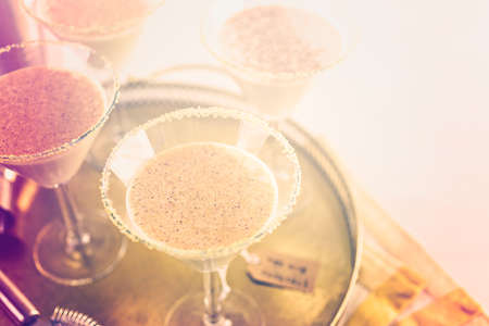 Holiday eggnog cocktail with dark rum and milk garnished with nutmeg.の写真素材