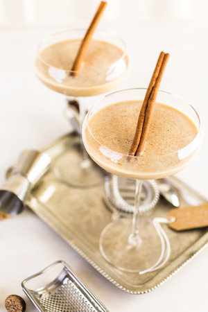 Holiday eggnog cocktail with dark rum and milk garnished with nutmeg.の写真素材