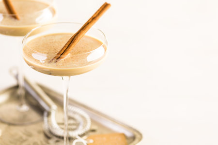 Holiday eggnog cocktail with dark rum and milk garnished with nutmeg.の写真素材