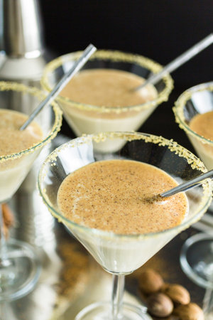 Egg nog cocktail in glasses rimmed with brown sugar at the minibar.の写真素材