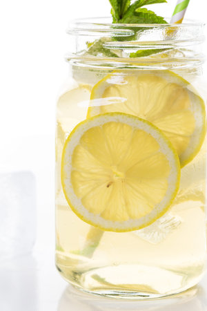 Green tea with citrus on a white backgound.