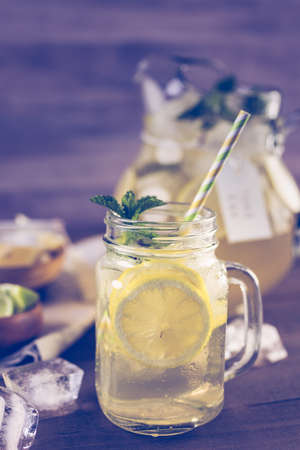 Green tea with citrus in drinking mason jar with ice.の写真素材