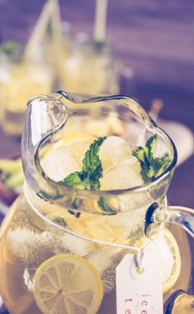 Green tea with citrus in pitcher.