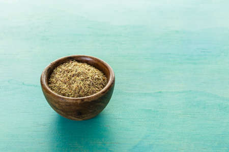 Flax seeds on painted wood board.の写真素材