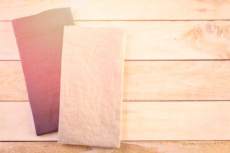 Linen dinner napkins on a wood background.の写真素材