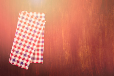 Linen dinner napkins on a wood background.