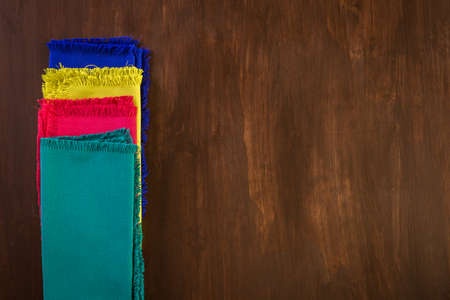 Linen dinner napkins on a wood background.の写真素材