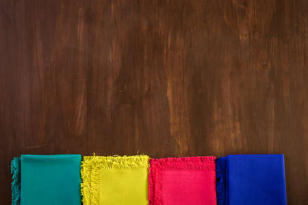 Linen dinner napkins on a wood background.の写真素材