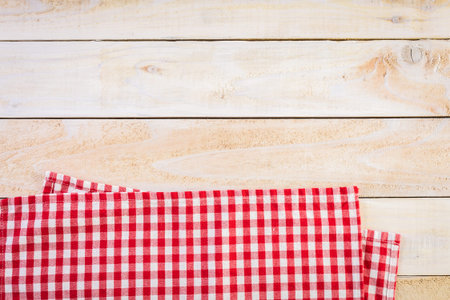 Dish towel on a wood background.