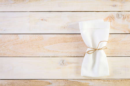 Linen dinner napkins on a wood background.の写真素材
