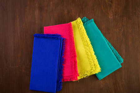 Linen dinner napkins on a wood background.の写真素材