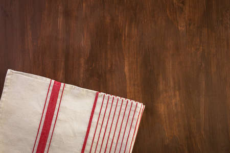 Dish towel on a wood background.の写真素材