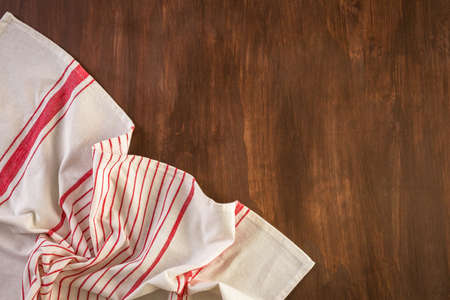 Dish towel on a wood background.の写真素材